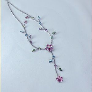 Dainty silver and rhinestone flower necklace.